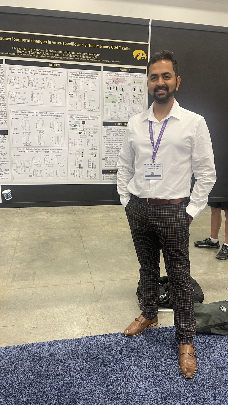 A person standing in front of a research poster