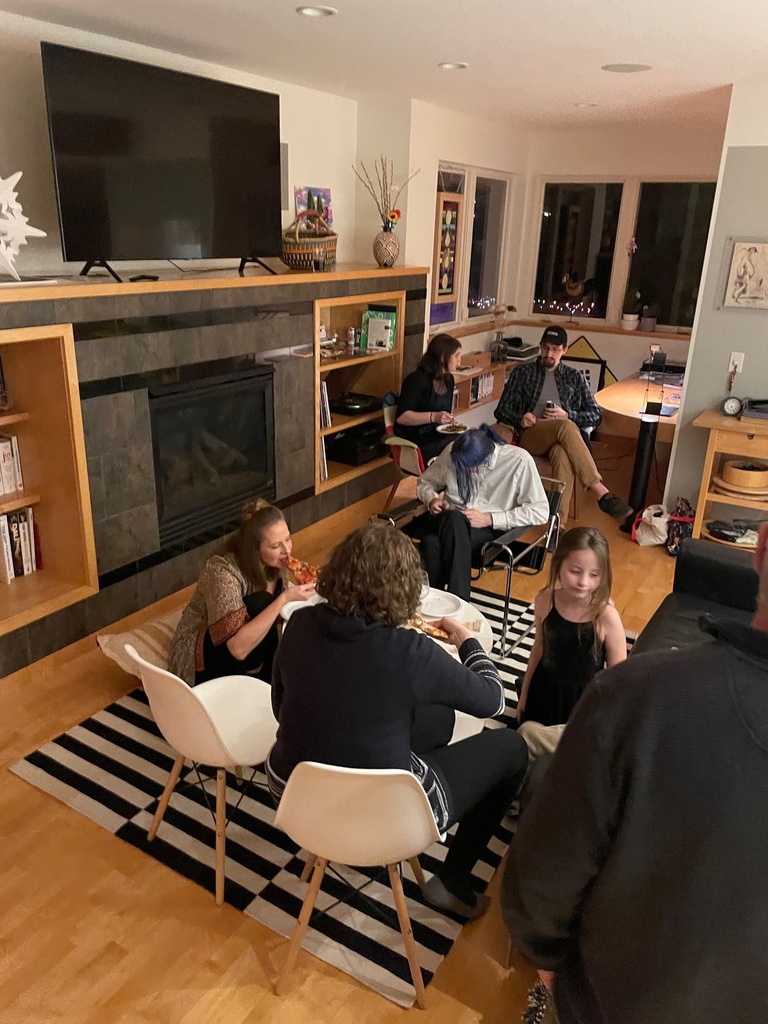 Several people in a living room 