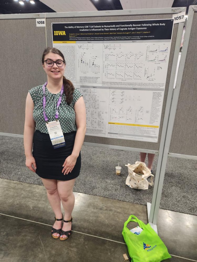 A person standing in front of a research poster