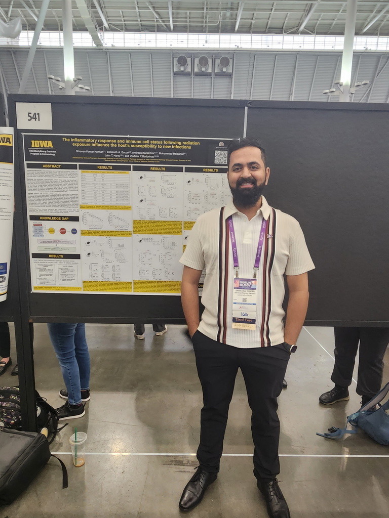 A person standing in front of a research poster
