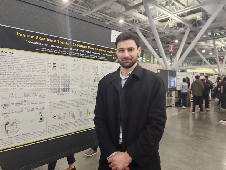 A person standing in front of a research poster