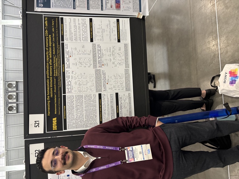 A person standing in front of a research poster